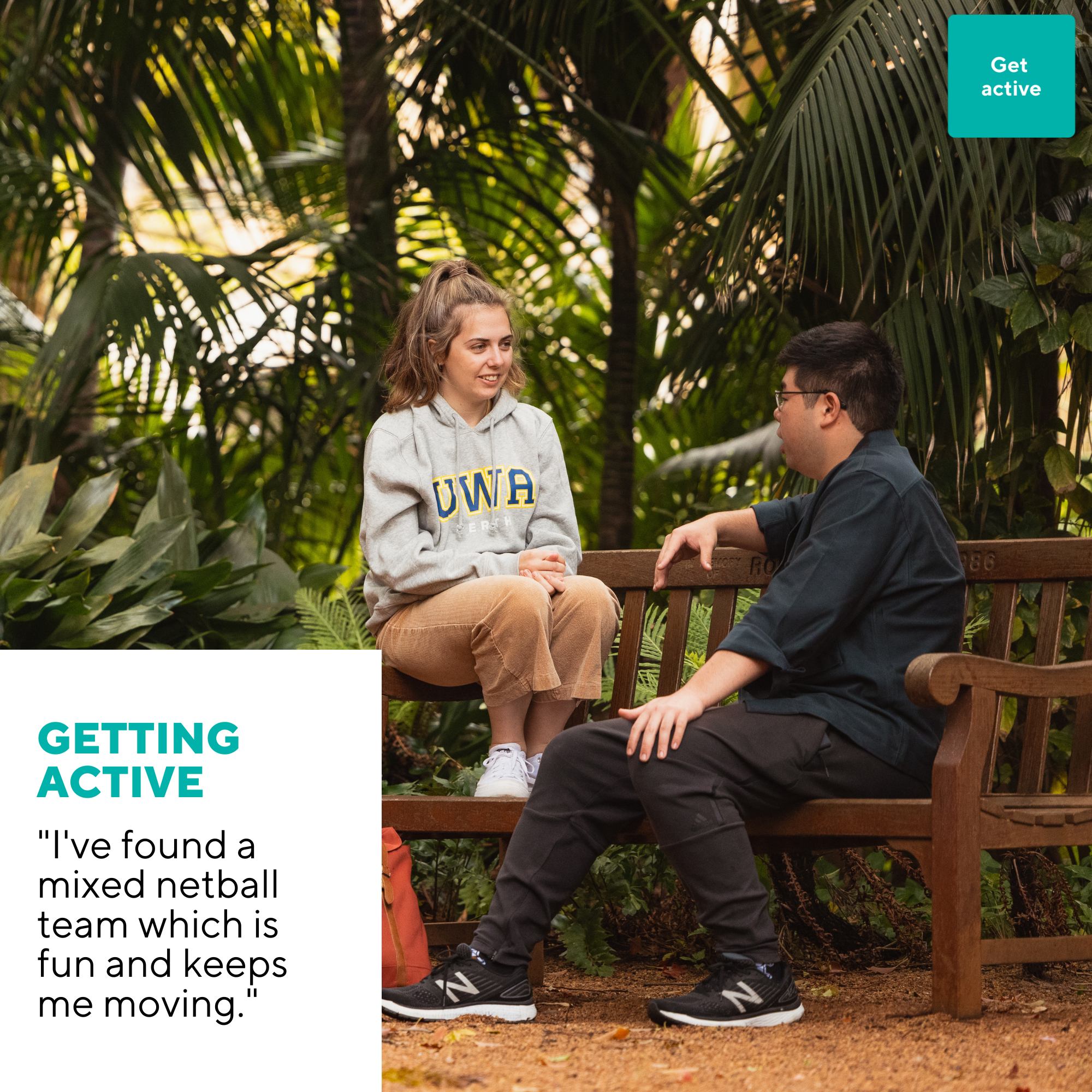 Two students sit in UWA Tropical Grove chatting